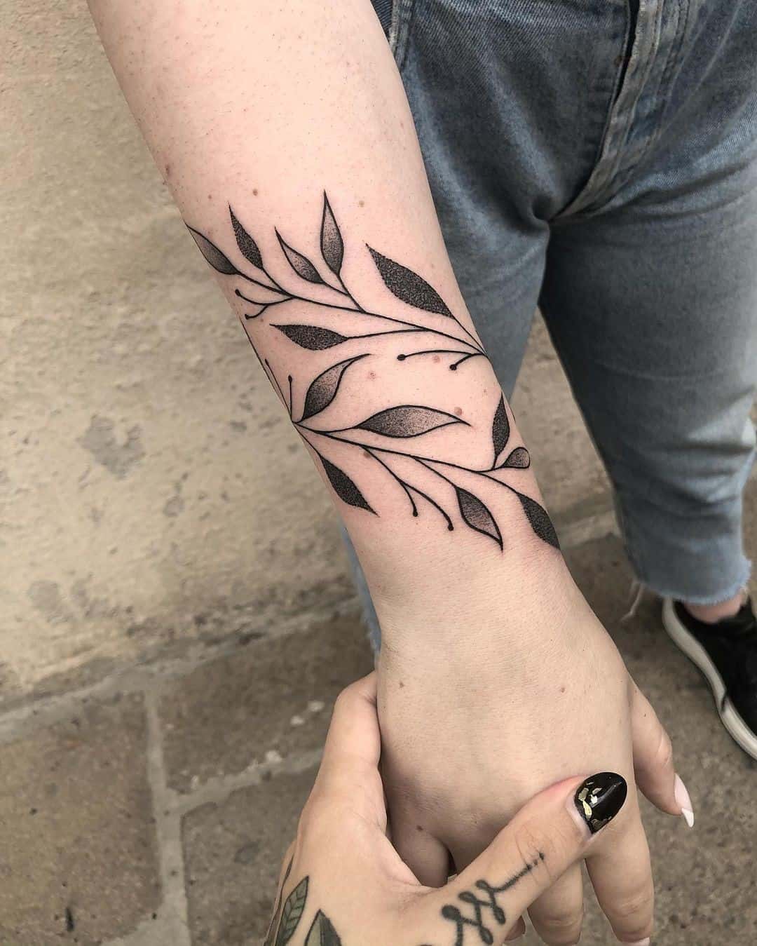 Flower bracelet scar cover tattoo.